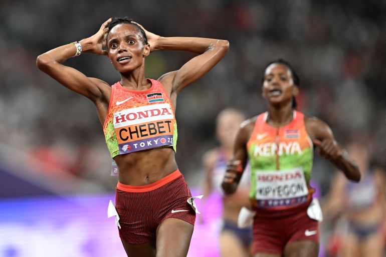 Kenya's Beatrice Chebet and Kenya's athlete Faith Kipyegon (R) celebrate after the women's 5000m final during the World Athletics Championships in Tokyo on September 20, 2025.