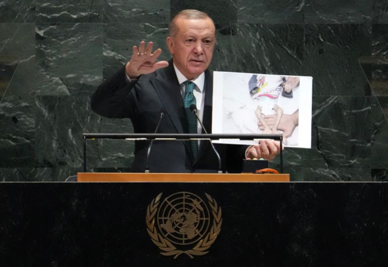 EDITORS NOTE: Graphic content / Turkey's President Recep Tayyip Erdogan holds up a photo from Gaza as he speaks during the General Debate of the United Nations General Assembly at the UN headquarters in New York City on September 23, 2025. (Photo by TIMOTHY A. CLARY / AFP)