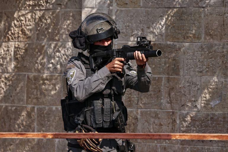 An Israeli soldiers takes aim during a raid on Ramallah city in the occupied West Bank on September 16, 2025.