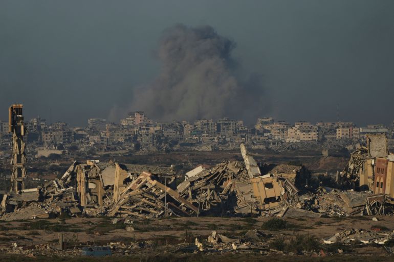 Smoke rises from an Israeli army bombardment in Gaza City, as seen from central Gaza Strip, Saturday, Sept. 13, 2025. (AP Photo/Abdel Kareem Hana)