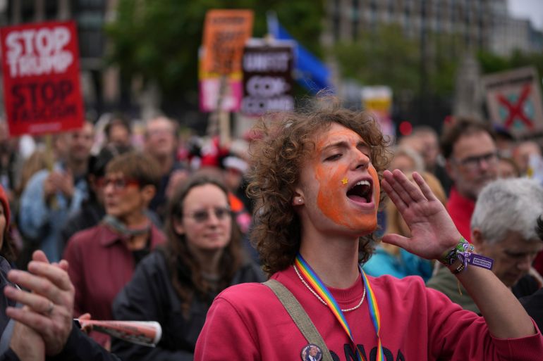 Stop Trump Coalition campaigners take part in a protest march against President Donald Trump's state visit in London, Wednesday, Sept. 17, 2025.(AP Photo/Kin Cheung)