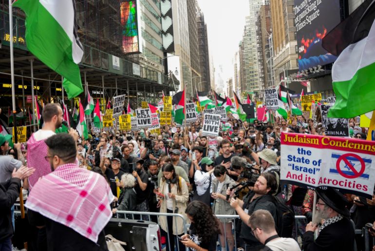 People protest in Times Square during a pro-Palestinian demonstration, Friday, Sept. 26, 2025, in New York. (AP Photo/Angelina Katsanis)