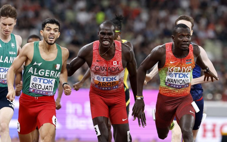 epa12392561 Emmanuel Wanyonyi (R) of Kenya wins the Men's 800m final at the World Athletics Championships 2025 in Tokyo, Japan, 20 September 2025. Djamel Sedjati (L) of Algeria placed second and Marco Arop (C) of Canada third. EPA/FRANCK ROBICHON
