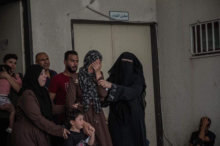GAZA CITY, GAZA - MAY 20: Relatives of Palestinian Hashem al-Shorafa, who was said to be killed during an Israeli raid on North Gaza City, mourn during his funeral on May 20, 2021 in Gaza City, Gaza. Civilian casualties continue to rise as Israel-Gaza violence entered a tenth day. More than 220 people in Gaza and twelve people in Israel have been killed as cross-border rocket exchanges continue. Israeli Prime Minister Benjamin Netanyahu has vowed to continue the bombing campaign despite increasing calls from the United Nations and the international community to end the conflict. The conflict which erupted May 10, comes after weeks of rising Israeli-Palestinian tension in East Jerusalem, which peaked with violent clashes inside the holy site of Al-Aqsa Mosque. (Photo by Fatima Shbair/Getty Images)