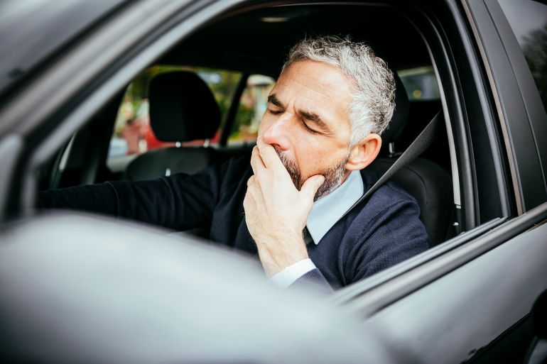 gettyimages-556453489-1758383466 Tired man in car, Vienna, Austria