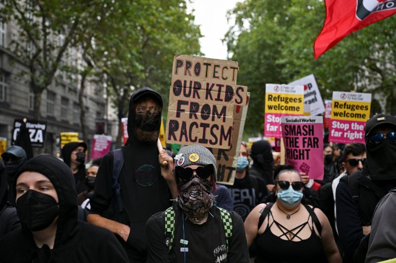reuters_68c64dd5-1757826517 Members of the campaign group, Stand Up to Racism, demonstrate against a rally organised by the British anti-immigration activist Stephen Yaxley-Lennon, also known as Tommy Robinson, in London, Britain, September 13, 2025. REUTERS/Chris J. Ratcliffe