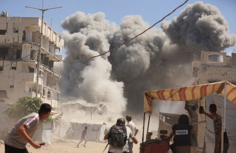 Smoke rises from an evacuated residential building which was housing displaced Palestinians, after it was hit by an Israeli air strike, in Gaza City, September 14, 2025. REUTERS/Dawoud Abu Alkas