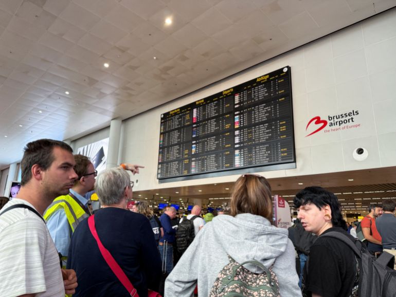 Travellers wait at Brussels airport, after a cyberattack at a service provider for check-in and boarding systems disrupted operations at several major European airports, in Zaventem near Brussels, Belgium September 20, 2025. REUTERS/Marta Fiorin