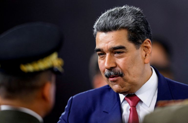 FILE PHOTO: Venezuela's President Nicolas Maduro prepares to leave at the end of a press conference, days after he said Venezuela would deploy military, police and civilian defenses at 284 "battlefront" locations across the country, amid heightened tensions with the U.S., in Caracas, Venezuela, September 15, 2025. REUTERS/Leonardo Fernandez Viloria/File Photo