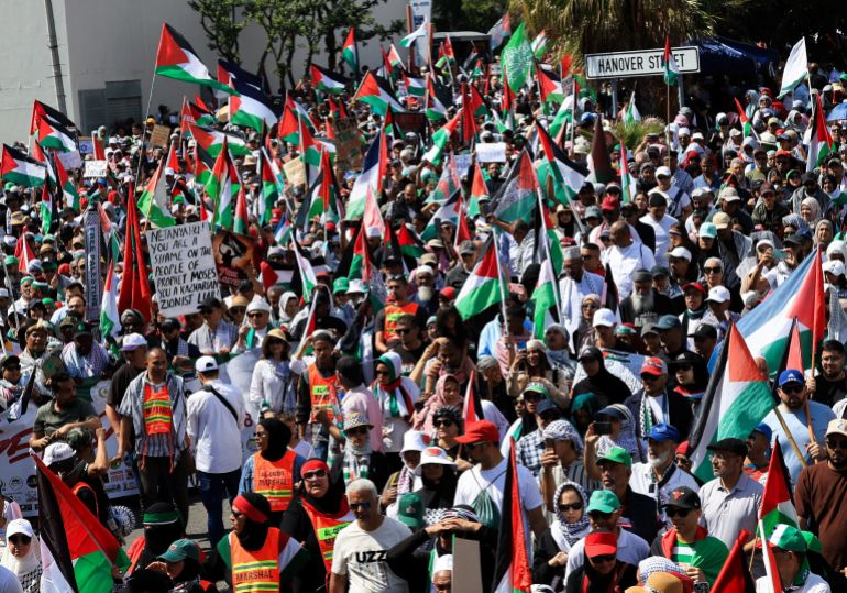 Demonstrators, many of them holding Palestinian flags, march towards South Aftica's parliament during a protest to show support to Palestinians in the Gaza Strip, in Cape Town, South Africa, September 27, 2025. REUTERS/Esa Alexander