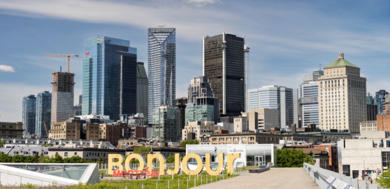 shutterstock_2495239219-1759245756 MONTREAL, QUEBEC, CANADA - MAY 25, 2024: - The skyline of downtown Montreal, the largest city in the Canadian province of Quebec.
