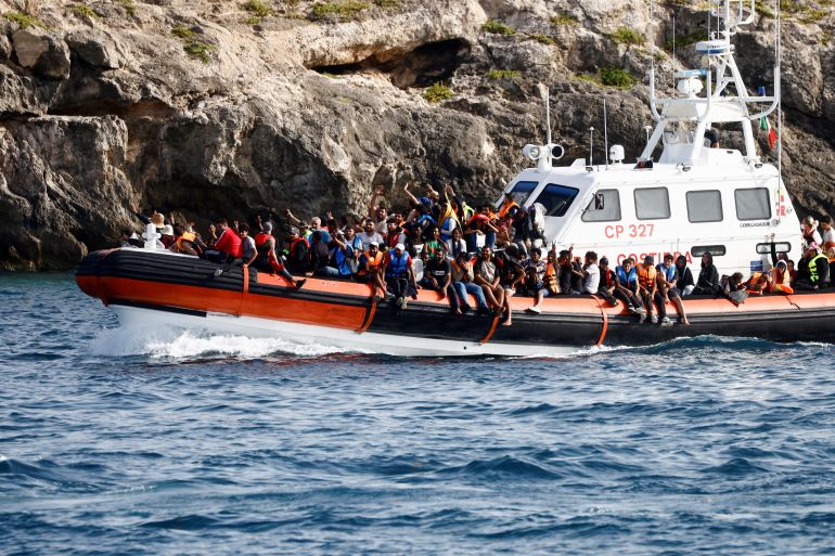 Migrants arrive on an Italian Coast Guard vessel after being rescued at sea, near the Sicilian island of Lampedusa, Italy, September 18, 2023. REUTERS/Yara Nardi