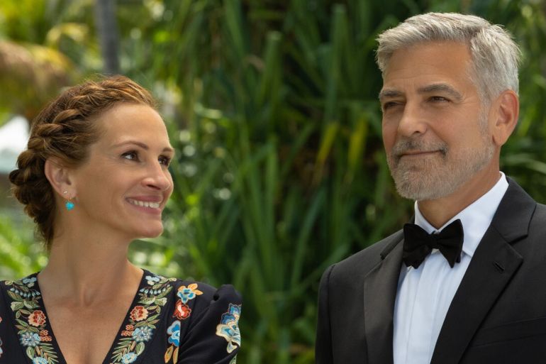 2-9 جورج كلوني و جوليا روبرتس في مشهد من الفيلم ( مواقع الكترونية)