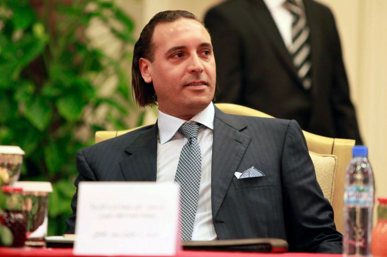 5454-1687467277 Hannibal Gaddafi, son of Libyan leader Muammar Gaddafi, sits while Libya's Shipping Corporation director Ali Belhadj and Jacques Hardelay, President of Cruise & Ferries in France of STX Europe, sign an agreement to build a cruise ship, in Tripoli June 30, 2010. Oslo-based STX Europe, the world's largest vessel building group, will provide Libya with the first Arab cruise liner. REUTERS/Ismail Zitouny (LIBYA - Tags: POLITICS BUSINESS TRANSPORT MARITIME)