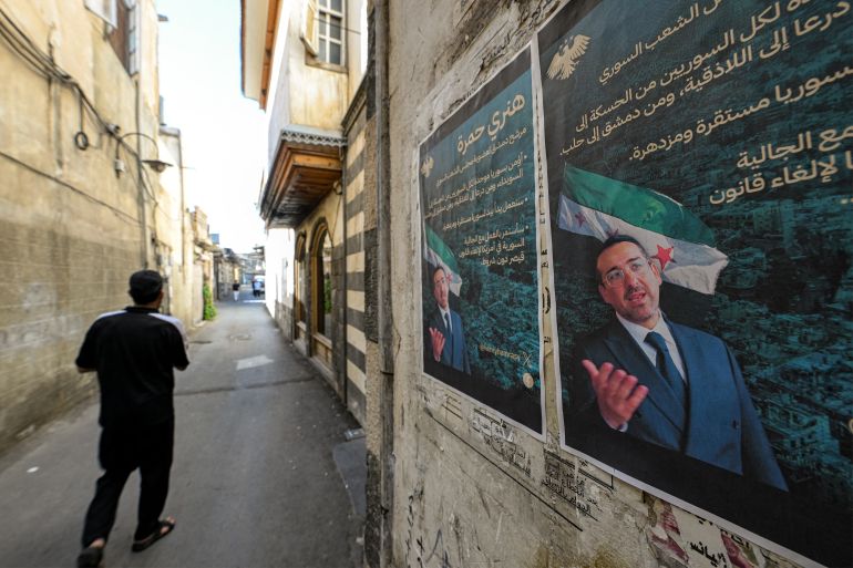 afp_68dfd7414561-1759500097 Election posters of Henry Hamra, a Syrian-American parliamentary candidate who is the son of the country's last rabbi and who if elected will be the first Jewish representative in the Syrian parliament since the late 1940s, are displayed on a wall along an alley in the Jewish quarter of the old city of Damascus on October 3, 2025, ahead of the upcoming vote on October 5.