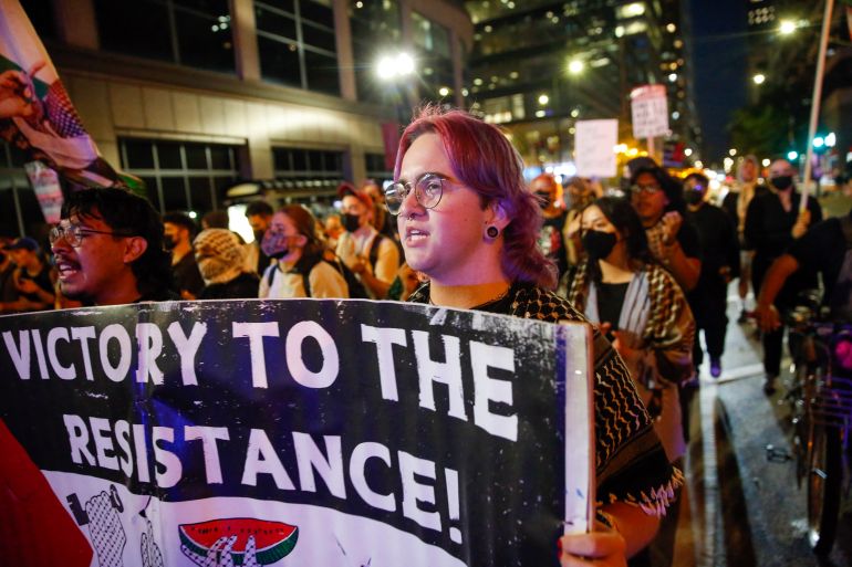 Pro-Palestine demonstrators march during a rally in support of Gaza through downtown Chicago, Illinois, on October 2, 2025. (Photo by OCTAVIO JONES / AFP)