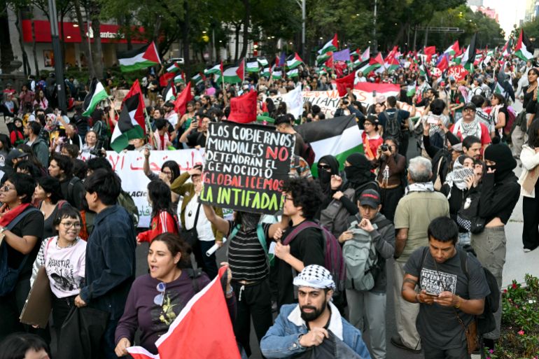 Demonstrators take part in a march demanding an end to attacks on the Gaza Strip and Palestinian territories as part of a national protest in Mexico City on October 7, 2025. (Photo by Yuri CORTEZ / AFP)