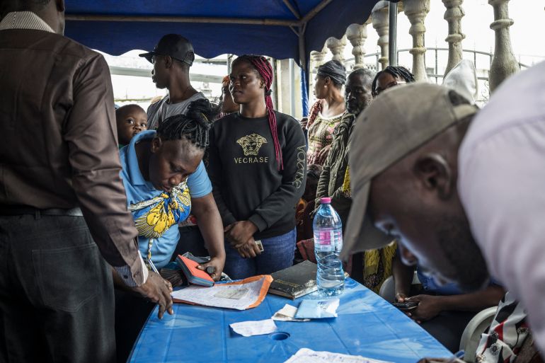 Cameroonian voters queue at an Election Cameroon (ELECAM) office in Douala, on October 8, 2025 to collect their voting card ahead of October 12, 2025 Cameroon Presidential Election.