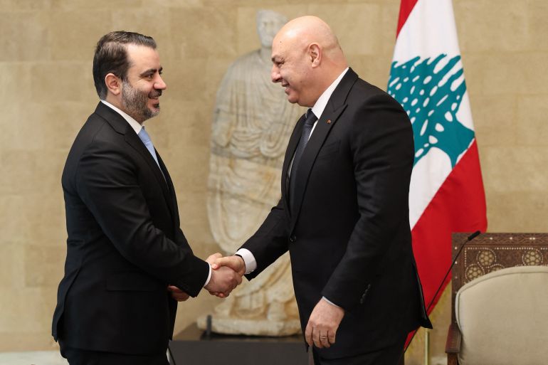 afp_68e9037fba5e-1760101247-2 In this handout photo released by the Lebanese Presidency press office on October 10, 2025, Lebanon's President Joseph Aoun (R) greets Syria's Foreign Minister Asad al-Shaibani before a meeting at the presidential palace in Baabda, east of Beirut. (Photo by Lebanese Presidency / AFP)