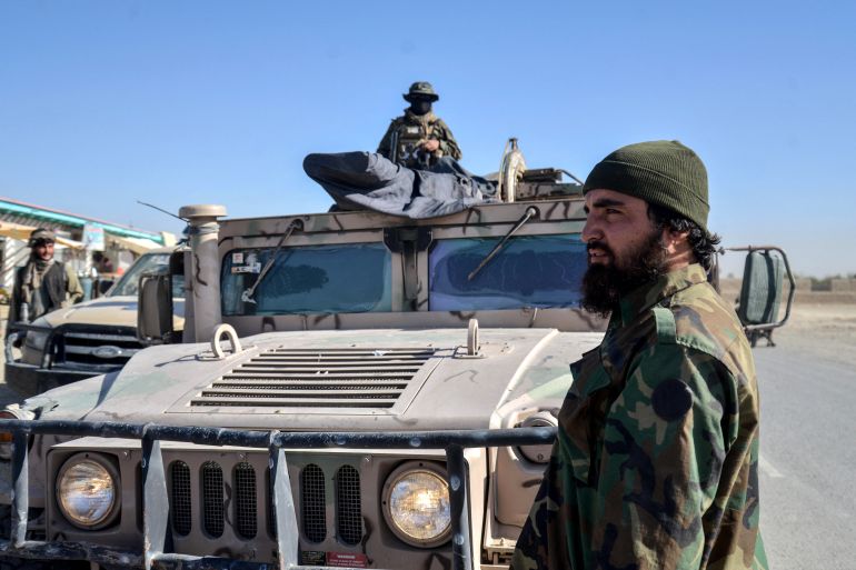 Taliban security personnel patrol on a Humvee in the Shorabak district near the Afghanistan-Pakistan border on October 12, 2025.