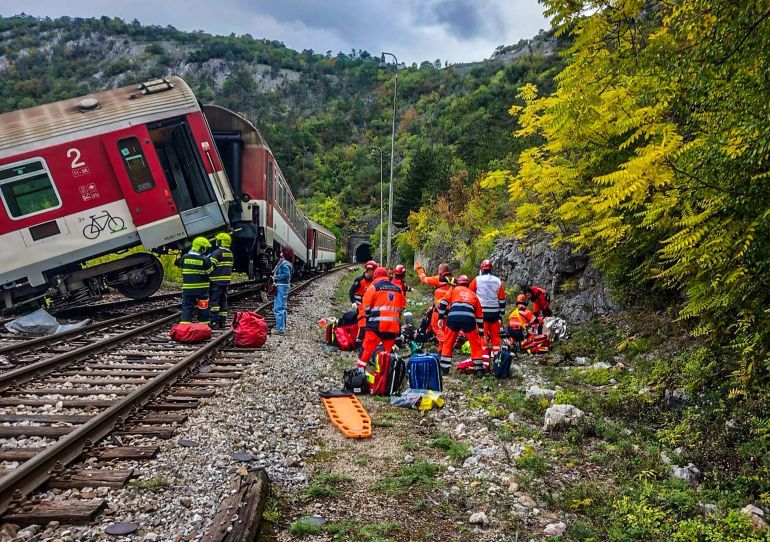 This handout photo provided by the Slovak Police via its Facebook site on October 13, 2025 shows rescue teams working on the accident site of two collided passenger trains near the village of Jablonov nad Turnou close to Kosice, Slovakia.
