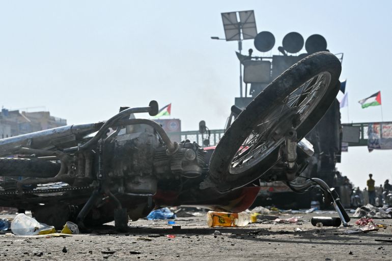afp_68ed0dc42863-1760366020 A motorbike lies abandoned in the aftermath of violent clashes between police personnel and anti-Israel protesters from the Tehreek-e-Labbaik Pakistan (TLP) party in Muridke on October 13, 2025.