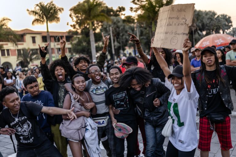 afp_68ef673496d7-1760519988 Young residents hold banners and dance to rock music during a concert as crowds gather for a civil society rally demanding President Rajoelina’s resignation, following the announcement by Madagascar’s Army CAPSAT unit that they would assume power in the country in Antananarivo, October 14, 2025.