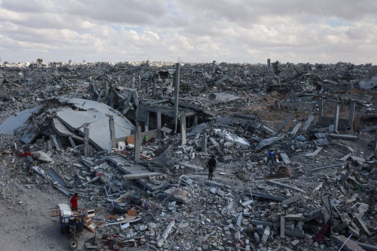afp_68f493ede06f-1760859117 Palestinians search the rubble of buildings amid widespread destruction due to Israeli bombardment in Khan Yunis in the southern Gaza Strip, as a ceasefire holds on October 12, 2025.