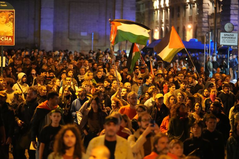 Pro-Palestinian demonstrators take to the streets in downtown Rome late Wednesday, Oct. 1, 2025, after news that a Gaza-bound aid flotilla had been intercepted by Israeli forces in the Mediterranean Sea. (AP Photo/Andrew Medichini)