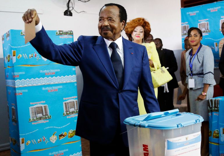 ap_68dfd7ee90972-1759500270 FILE - Cameroon's incumbent President Paul Biya, of the Cameroon People's Democratic Movement party, casts his vote during the presidential elections in Yaounde, Cameroon, Sunday Oct. 7, 2018. (AP Photo/Sunday Alamba, File)