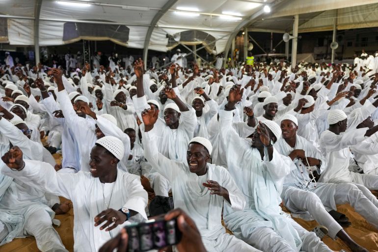 ap_68ebd58706f62-1760286087 CORRECTS DATE Men sing and gesture as they mark Prophet Muhammad's birthday, known as Mawlid, in Dakar, Senegal, Friday Sept. 5, 2025. (AP Photo/Misper Apawu)