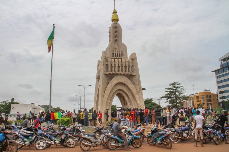 ap_68ece0f739682-1760354551 FILE - People gather at Place de l'Independence in Mali's capital Bamako, Aug. 19, 2020. (AP Photo/Arouna Sissoko, File)
