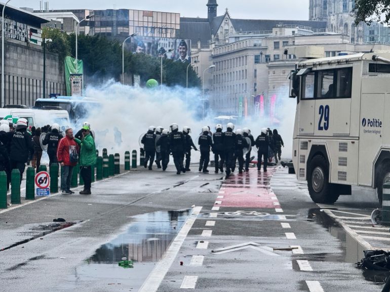 ap_68ee768e415e1-1760458382 Police on alert during a demonstration and general strike in Brussels, Tuesday, Oct. 14, 2025. (AP Photo/Sylvain Plazy)