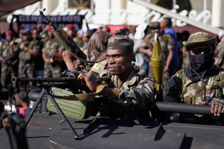 ap_68ef67e52cb87-1760520165 Troops loyal to CAPSAT military unit commander Col. Michael Randrianirina joins protesters to announce that the armed forces are taking control of the country in Antananarivo, Madagascar, Tuesday, Oct. 14, 2025. (AP Photo/Brian Inganga)