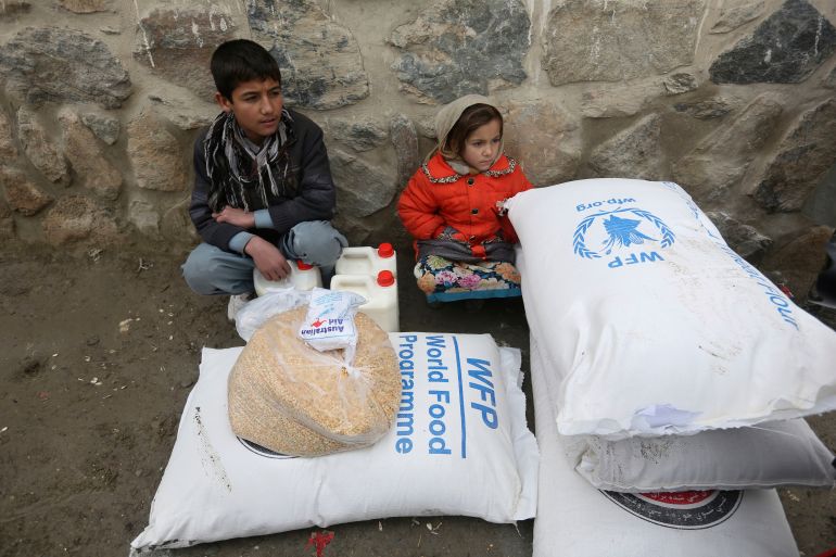 ap_68efa88e3b871-1760536718 FILE - Children wait for transportation after receiving food donated by the World Food Program, in Kabul, Afghanistan, Jan. 24, 2017. (AP Photo/Rahmat Gul, File)