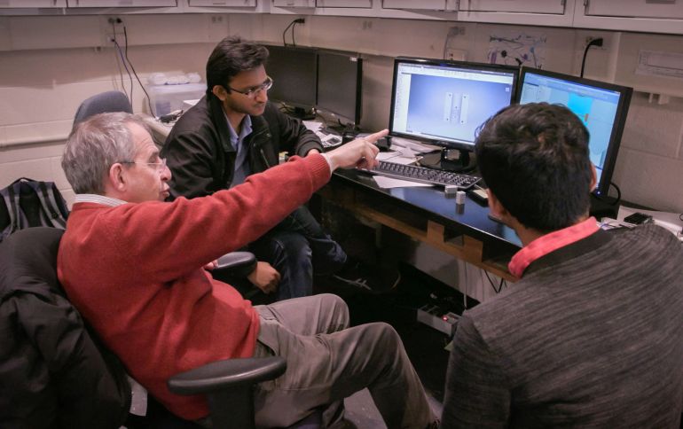 French-born professor Michel Devoret, one of three U.S.-based scientists who won the 2025 Nobel Prize in Physics, points at a screen in an undated photograph. Dan Renzetti/Yale University/Handout via REUTERS. NO RESALES. NO ARCHIVES THIS IMAGE HAS BEEN SUPPLIED BY A THIRD PARTY