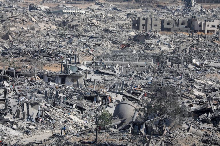 epa12447086 Internally displaced Palestinians walk along a street among the rubble of destroyed buildings amid a ceasefire between Israel and Hamas, in Gaza City, 11 October 2025. US President Donald Trump announced that Israel and Hamas have agreed to the first phase of a Gaza peace plan. The deal involves the release of Israeli hostages and Palestinian prisoners, the withdrawal of Israeli forces, and the delivery of humanitarian aid to Gaza. EPA/MOHAMMED SABER