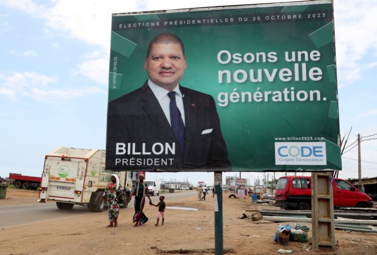 epa12445315 Women walk past a presidential election poster for Jean-Louis Billon of Democratic Congress in Abidjan, Ivory Coast, 10 October 2025. The electoral campaign for the presidential election of 25 October 2025 kicked off on 10 October. Incumbent President Alassane Ouattara is running for a fourth term and faces four competitors, including former First Lady Simone Ehivet Gbagbo of Mouvement des Generations Capables (MGC). EPA/LEGNAN KOULA