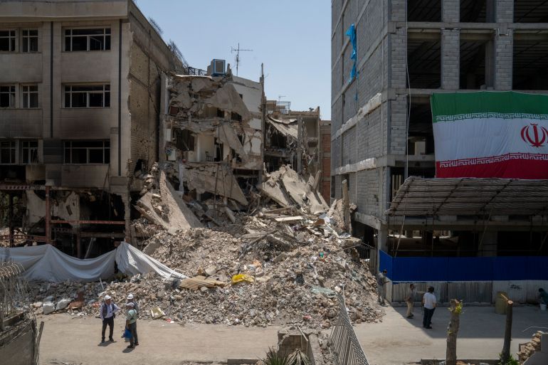 getty_68dffb4d38-1759509325 TEHRAN, IRAN - JULY 11: Government experts inspect the damage to buildings damaged in the Israeli bombing of central Tehran, on July 11, 2025 in Tehran, Iran. (Photo by Majid Saeedi/Getty Images)