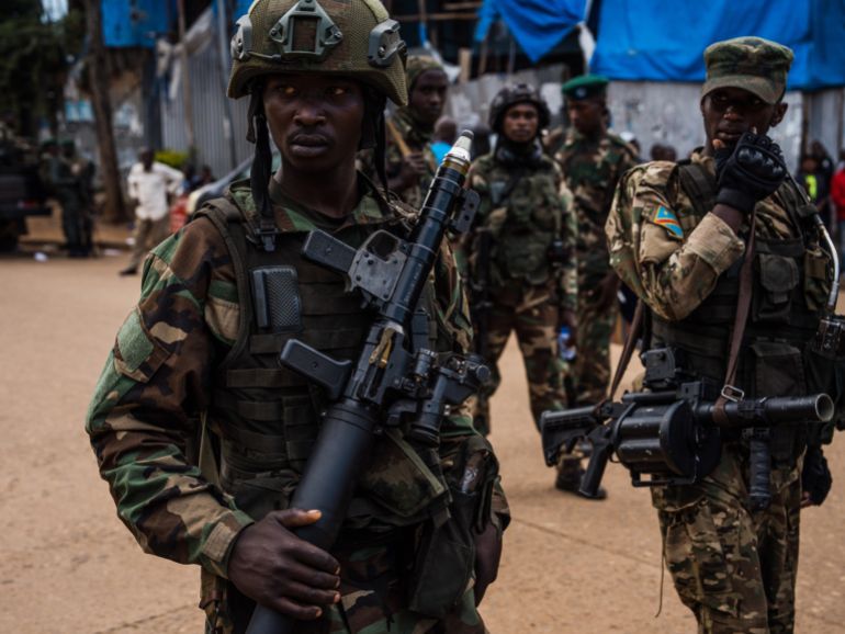 BUKAVU, DEMOCRATIC REPUBLIC OF CONGO - FEBRUARY 22: M23 rebels guard a unit of surrendering Congolese police officers who will be recruited into the rebel group on February 22, 2025 in Bukavu, Democratic Republic of Congo. The Rwandan-backed rebel group M23 swept into Bukavu over the weekend, taking control of the city with a population of approximately one million people in Democratic Republic of the Congo's (DRC) South Kivu Province. Hundreds of thousands of people in the eastern part of the DRC have been displaced as the rebel group has made swift advances against Congolese pro-government forces in recent weeks. (Photo by Hugh Kinsella Cunningham/Getty Images)