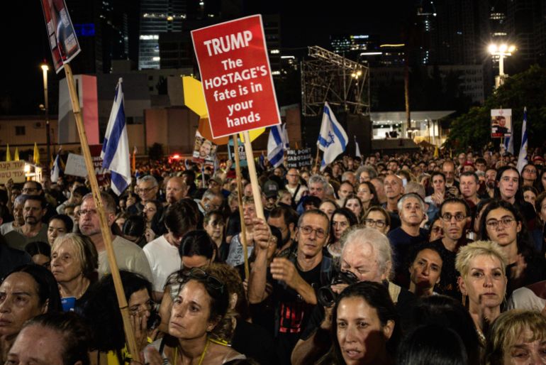 TEL AVIV, ISRAEL - OCTOBER 04: People chant slogans and hold placards in support of hostages still held by Hamas during a solidarity protest, calling for an end to the war and the release of all remaining Israeli hostages on October 04, 2025 in Tel Aviv, Israel. This week, Hamas said it would partly accede to a peace deal brokered by the U.S. president and release the Israeli hostages held in Gaza since Oct. 7, 2023. However, the Palestinian militant group asked for negotiations on several conditions of the 20-point-plan. The Hostages and Missing Families Forum, which represents loved ones of the Israeli captives, said in a statement that "we are in decisive days for a deal - days that will determine when the living hostages return for rehabilitation and the deceased return for proper burial." (Photo by Chris McGrath/Getty Images)