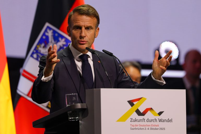 SAARBRUECKEN, GERMANY - OCTOBER 3: France's President Emmanuel Macron delivers a speech during the celebrations for the Day of German Unity 2025 on October 3, 2025 in Saarbruecken, Germany. German Unity Day is celebrated annually on 03 October to commemorate the reunification of East and West Germany in 1990. (Photo by Christopher Neundorf - Pool / Getty Images)