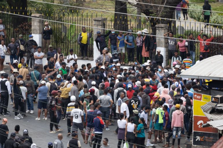 getty_68e764d972-1759995097-2 ANTANANARIVO, MADAGASCAR - SEPTEMBER 30: People gather in the streets as youth-led protests over longstanding water and power cuts continue on September 30, 2025 in Antananarivo, Madagascar. Predominately "Gen-Z" protesters have taken to the streets across multiple cities in Madagascar to decry recurring supply problems with water and power in the country. The unrest, which the UN alleges has left at least 22 people dead and 100 others injured, prompted the country's president to dissolve the current government. (Photo by Getty Images)