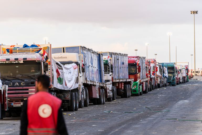 RAFAH, EGYPT - OCTOBER 12: Trucks carrying aid wait at the border crossing for entry into the Gaza Strip on October 12, 2025 in Rafah, Egypt. This week's ceasefire deal between Israel and Hamas has brought an end to the two years of war that followed the attacks of Oct. 7, 2023, allowing aid groups to increase delivery of humanitarian relief. (Photo by Ali Moustafa/Getty Images)