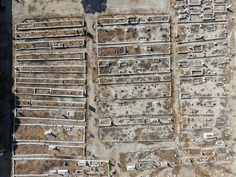 getty_68f2636e78-1760715630 ZAMALKA, SYRIA - AUGUST 21: The mass graves of victims of the former Syrian regime's massacares, on August 21, 2025 in Zamalka, Syria. On 21 August 2013 President Bashar al-Assad ordered strikes on two opposition-controlled areas of Ghouta, in the suburbs around Damascus. The rockets contained the chemical nerve agent Sarin which went on to kill up to 1700 people. The attack was the deadliest use of chemical weapons since the Iran-Iraq War. (Photo by Ali Haj Suleiman/Getty Images)