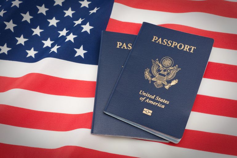 gettyimages-182687067-1747426695-1 U.S. Passports on an American Stars and Stripes flag.