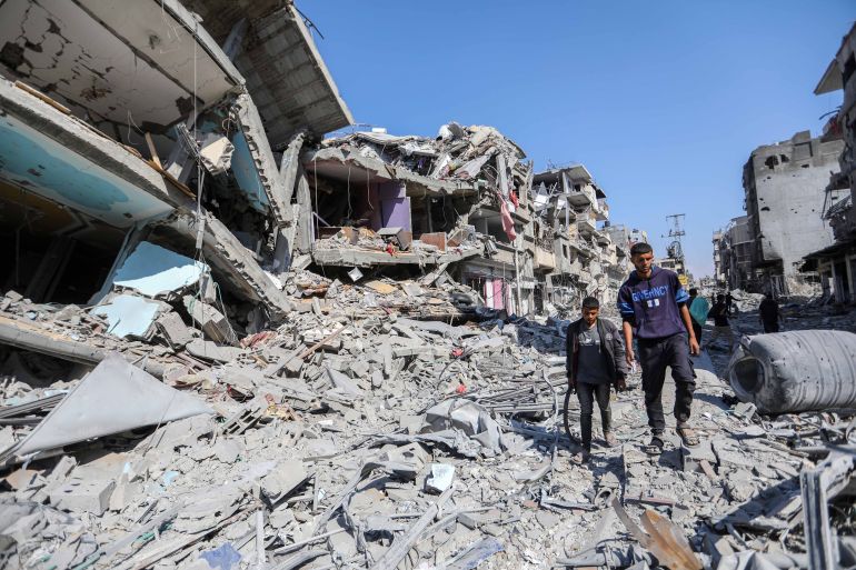 gettyimages-2146568801-1760970725 KHAN YUNIS, GAZA - APRIL 7: People inspect damage and remove items from their homes following Israeli airstrikes on April 07, 2024 in Khan Yunis, Gaza. The Israeli military reported today that it has scaled back ground troops in the southern Gaza Strip, leaving only one brigade. April 7th marks six months since Hamas led an attack on Israel, killing 1,200 people and taking around 250 people hostage. In response, Israel launched a retaliatory war in Gaza that has killed more than 33,000 people, according to the Gazan health ministry. As the latest round of ceasefire negotiations have stalled, the humanitarian crisis worsens in Gaza, while more than 100 Israeli hostages remain in captivity. (Photo by Ahmad Hasaballah/Getty Images)