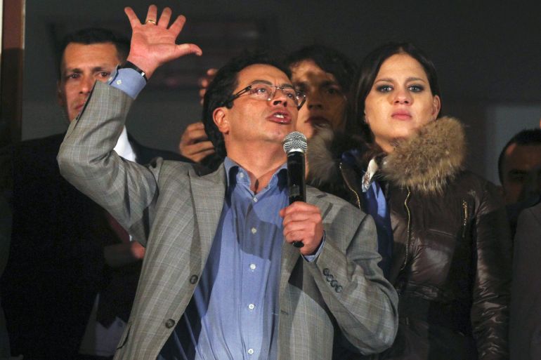 Bogota's ousted mayor Gustavo Petro gestures during a speech to supporters at the mayor building in Bogota March 19, 2014. Petro, the mayor of Colombia's capital city Bogota, was ousted from his post on Wednesday, President Juan Manuel Santos said in a controversial decision that could affect May presidential elections and a peace process with left-wing rebels. Petro, 53, a former guerrilla, was dismissed from his post by the inspector general in December last year over mismanagement but stayed pending a run of judicial appeals, the last of which ended on Tuesday and did not reverse the decision. REUTERS/ John Vizcaino ( COLOMBIA - Tags: POLITICS CIVIL UNREST)