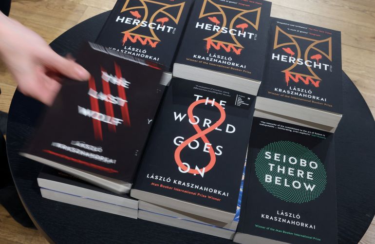 pic-5542-1760116801 نوبل والسينما Store manager Declan O'Brien arranges a display of books written by Hungarian author Laszlo Krasznahorkai, winner of the 2025 Nobel Prize for Literature, at Waterstones bookshop in London, Britain, October 9, 2025. REUTERS/Toby Melville