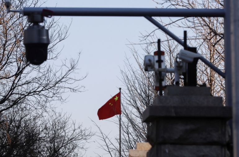 FILE PHOTO: A Chinese flag is seen near surveillance cameras outside the Beijing No. 2 Intermediate People's Court, where Australian journalist Cheng Lei is expected to face trial on state secrets charges, in Beijing